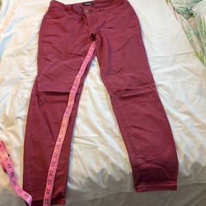 Dark rose colored denim jeans with a 28 inch inseam